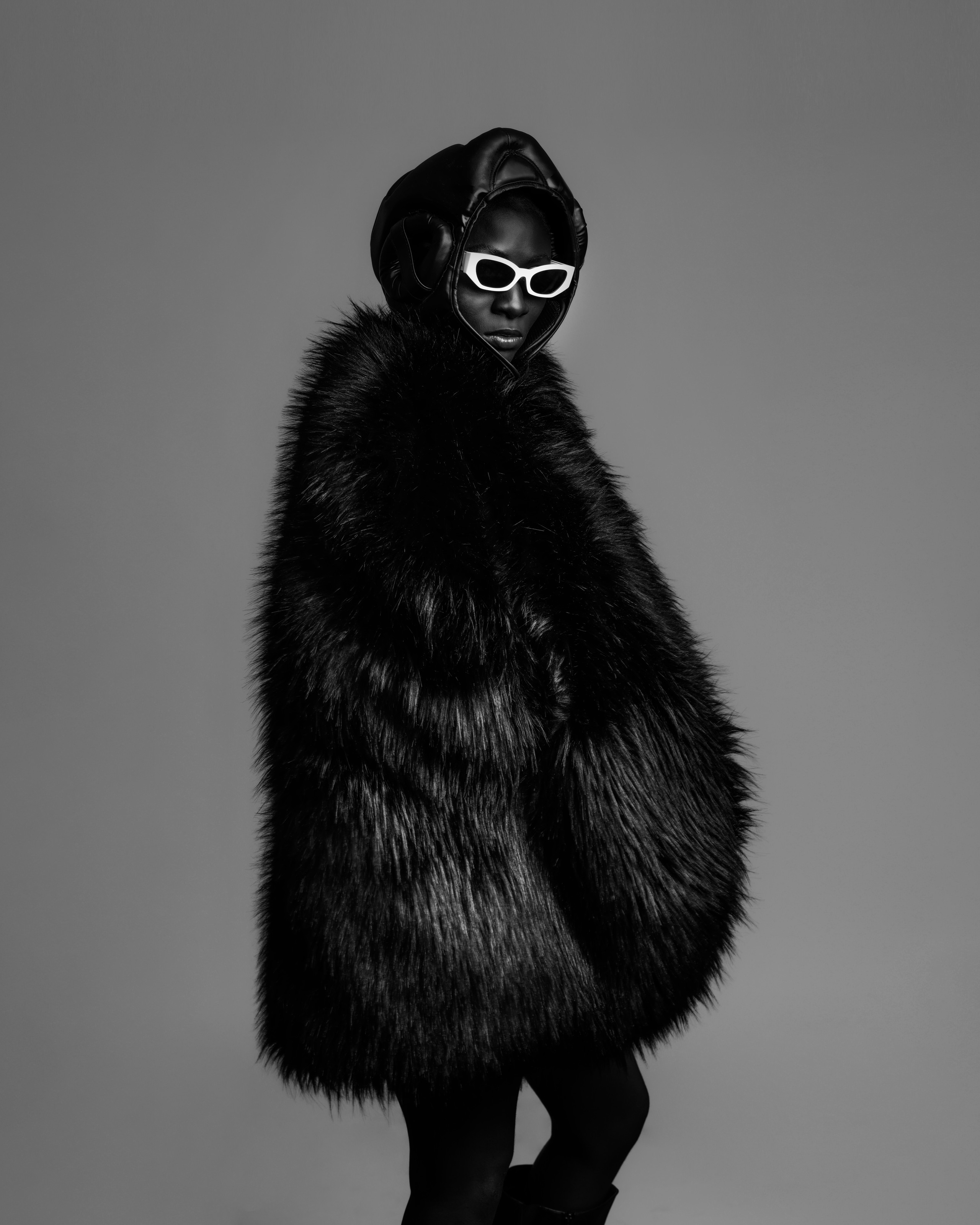 Black fur and white eyewear fashion portrait